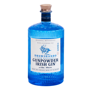 A bottle of Drumshanbo Gunpowder Irish Gin with a textured blue glass body, a white label, and a cork stopper, centered on a plain white background.