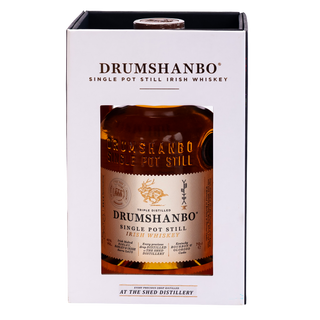 A boxed bottle of Drumshanbo Single Pot Still Distilled Whiskey, shown in its white retail packaging with a clear front window displaying the amber liquid and label inside.