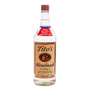 A bottle of Tito's Handmade Vodka on a solid white background, featuring the classic tan and red label with the brand name clearly visible.
