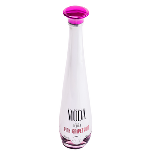 A bottle of MODA Tequila Pink Grapefruit on a solid white background. The bottle is white with a vibrant magenta-pink cap and matching pink grapefruit flavor text printed on the front.
