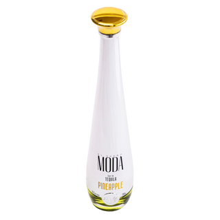 A white glass bottle of MODA Tequila Pineapple with a metallic gold cap and yellow-green liquid inside, centered on a plain white background.