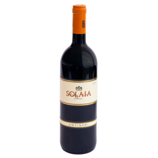 A bottle of Solaia Antinori red wine with a dark glass body, cream label, and orange neck wrap, centered on a plain white background.