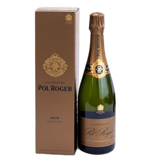 A bottle of Pol Roger Rich Demi Sec champagne next to its brown presentation box with gold detailing, set against a plain white background.