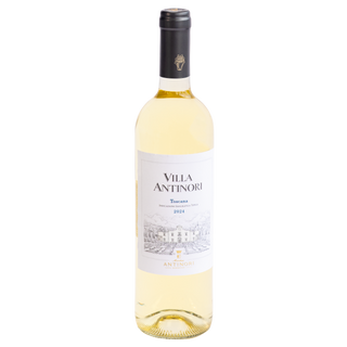 A bottle of Villa Antinori Toscana 2024 white wine, featuring a pale yellow liquid, a white label with black text and a line drawing of a villa, and a black foil neck wrap, isolated on a white background.