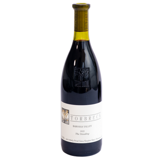 A bottle of Torbreck Barossa Valley 2022 The Steading red wine, featuring a dark glass bottle with a cream-colored label and a yellow-green foil capsule at the neck, set against a plain white background.