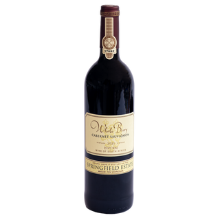 A bottle of Whole Berry Springfield Estate Cabernet Sauvignon 2021, featuring a dark glass bottle with a cream-colored label and a gold seal on the neck, set against a plain white background.