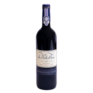 A bottle of The Work of Time 2018 Springfield Estate red wine, featuring a dark glass bottle with a cream-colored label and blue accents, set against a plain white background.