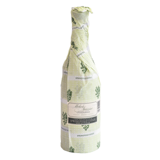 A bottle of Methode Ancienne Springfield Estate Chardonnay covered in a light green and white patterned protective wrap, shown against a plain white background.
