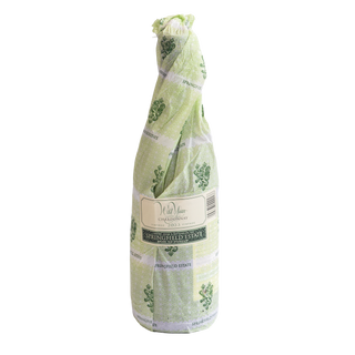 A bottle of Wild Yeast Chardonnay 2023 bottle packaged in light green and white patterned paper wrapping with a cream label reading 'SPRINGFIELD ESTATE'.