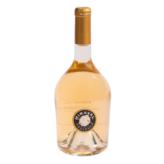 A bottle of Miraval Cotes de Provence rosé grape wine with a gold foil cap and a circular blue, gold, and white label, set against a plain white background.