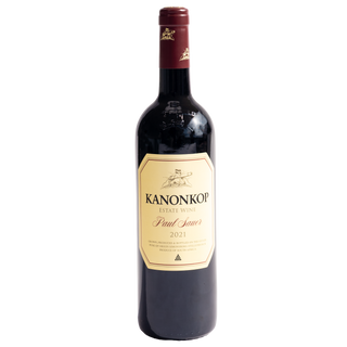 A bottle of Kanonkop Estate Winery Paul Sauer 2021 red wine, featuring a dark glass bottle with a cream-colored label and a dark red foil capsule at the neck, set against a plain white background.